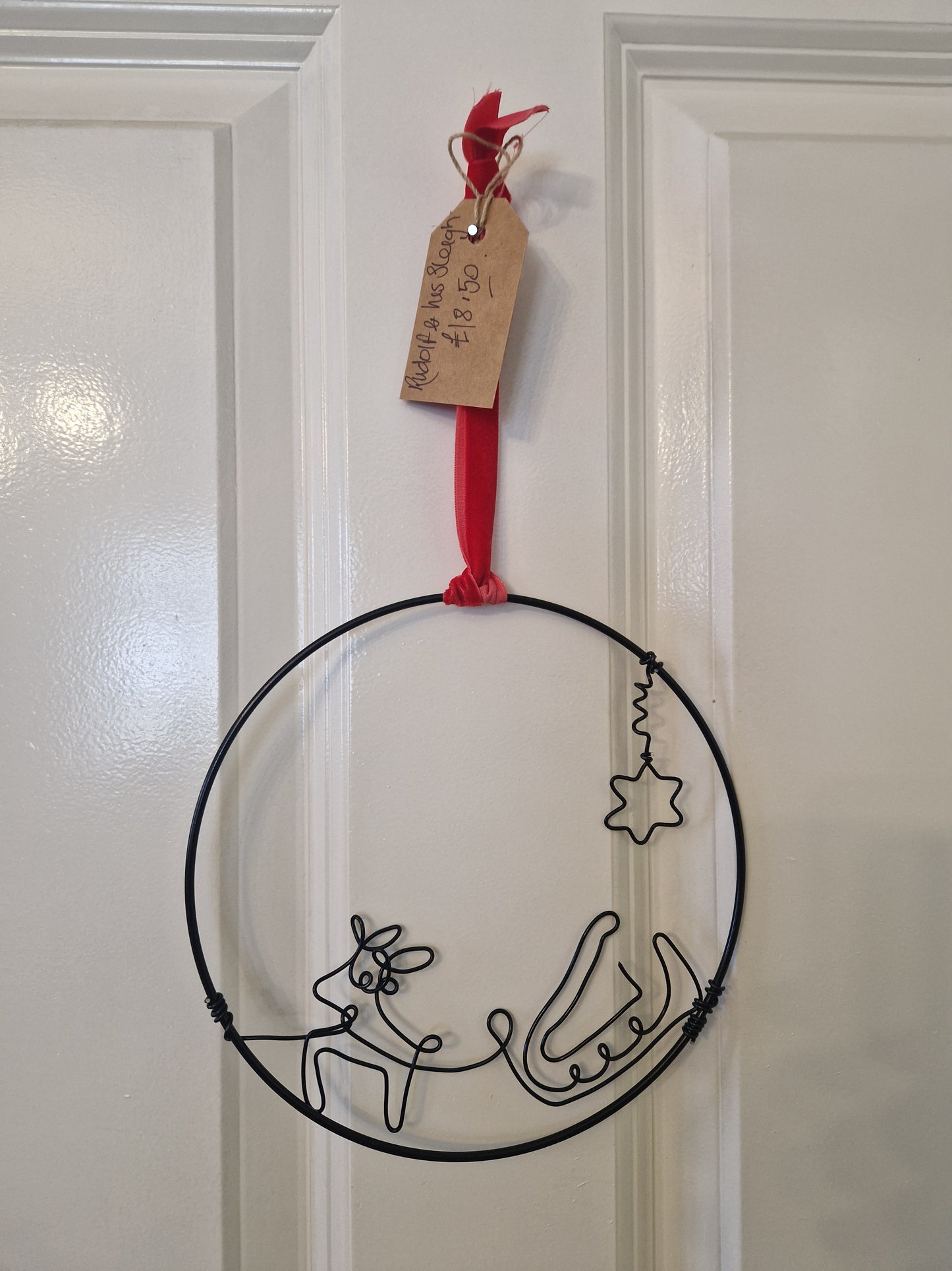 Handcrafted wire Christmas decor hoop.